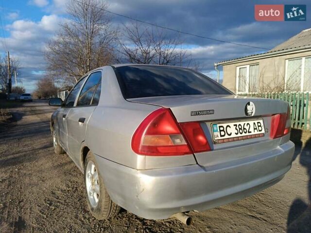 Серый Мицубиси Лансер, объемом двигателя 1.3 л и пробегом 390 тыс. км за 1800 $, фото 6 на Automoto.ua