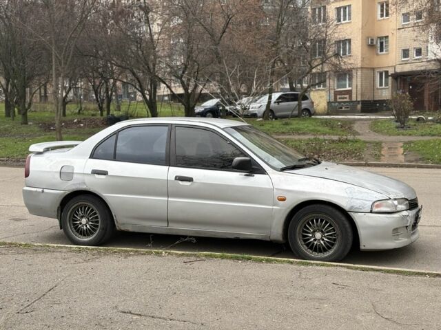 Сірий Міцубісі Lancer, об'ємом двигуна 1.3 л та пробігом 200 тис. км за 1100 $, фото 1 на Automoto.ua