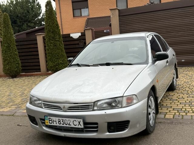 Серый Мицубиси Лансер, объемом двигателя 1.3 л и пробегом 320 тыс. км за 1450 $, фото 3 на Automoto.ua