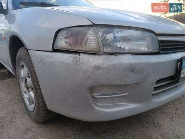 Серый Мицубиси Лансер, объемом двигателя 1.3 л и пробегом 390 тыс. км за 1800 $, фото 47 на Automoto.ua