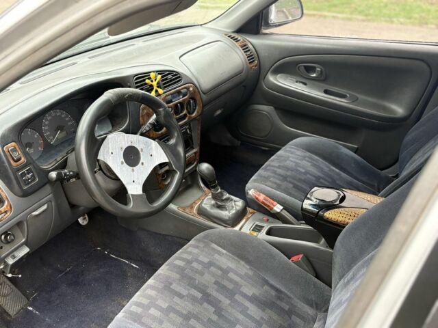 Сірий Міцубісі Lancer, об'ємом двигуна 1.3 л та пробігом 200 тис. км за 1100 $, фото 5 на Automoto.ua