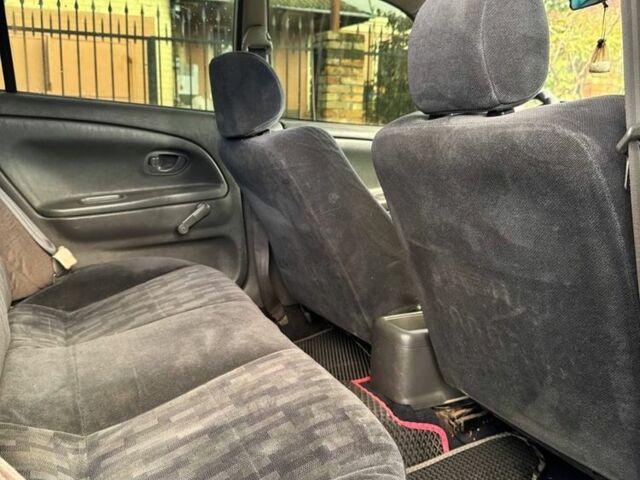 Серый Мицубиси Лансер, объемом двигателя 1.3 л и пробегом 300 тыс. км за 1000 $, фото 6 на Automoto.ua