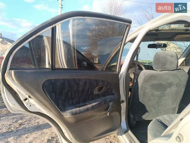 Серый Мицубиси Лансер, объемом двигателя 1.3 л и пробегом 390 тыс. км за 1800 $, фото 7 на Automoto.ua