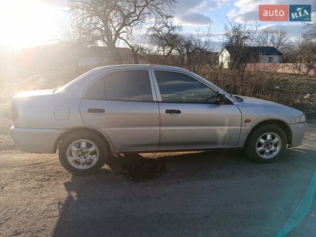 Серый Мицубиси Лансер, объемом двигателя 1.3 л и пробегом 390 тыс. км за 1800 $, фото 4 на Automoto.ua