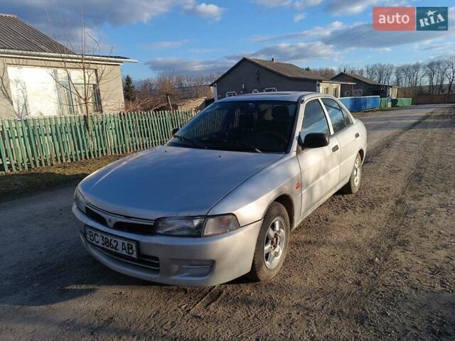 Серый Мицубиси Лансер, объемом двигателя 1.3 л и пробегом 390 тыс. км за 1800 $, фото 1 на Automoto.ua