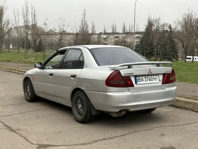 Сірий Міцубісі Lancer, об'ємом двигуна 1.3 л та пробігом 200 тис. км за 1100 $, фото 3 на Automoto.ua