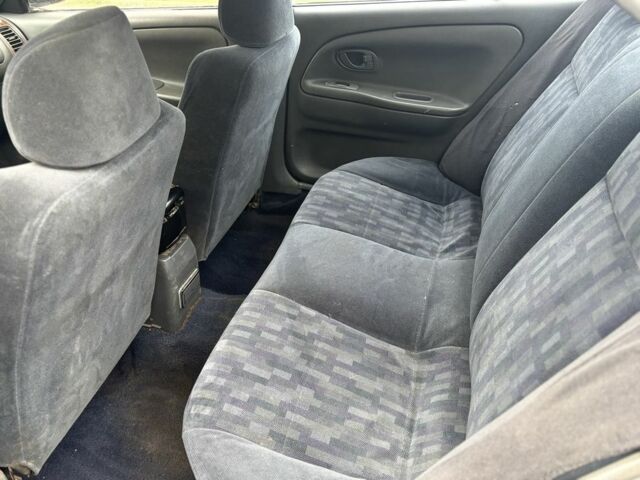 Сірий Міцубісі Lancer, об'ємом двигуна 1.3 л та пробігом 200 тис. км за 1100 $, фото 6 на Automoto.ua