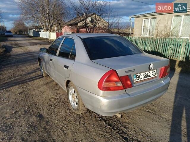 Серый Мицубиси Лансер, объемом двигателя 1.3 л и пробегом 390 тыс. км за 1800 $, фото 28 на Automoto.ua