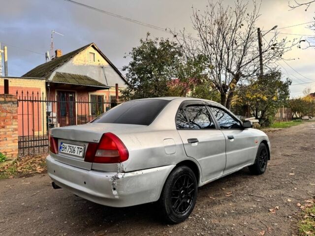 Серый Мицубиси Лансер, объемом двигателя 1.3 л и пробегом 300 тыс. км за 1000 $, фото 2 на Automoto.ua