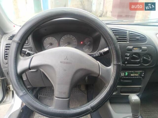 Серый Мицубиси Лансер, объемом двигателя 1.3 л и пробегом 367 тыс. км за 1050 $, фото 11 на Automoto.ua