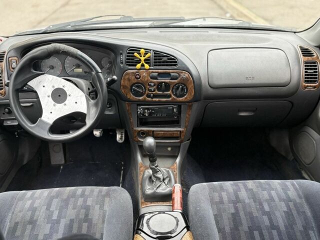 Сірий Міцубісі Lancer, об'ємом двигуна 1.3 л та пробігом 200 тис. км за 1100 $, фото 7 на Automoto.ua