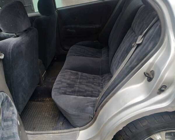 Серый Мицубиси Лансер, объемом двигателя 1.3 л и пробегом 367 тыс. км за 1050 $, фото 14 на Automoto.ua