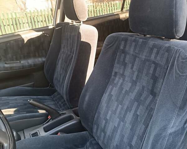 Серый Мицубиси Лансер, объемом двигателя 1.3 л и пробегом 390 тыс. км за 1800 $, фото 16 на Automoto.ua