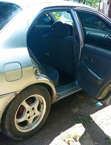 Сірий Міцубісі Lancer, об'ємом двигуна 1.3 л та пробігом 362 тис. км за 2300 $, фото 3 на Automoto.ua