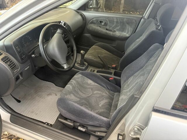 Сірий Міцубісі Lancer, об'ємом двигуна 1.3 л та пробігом 555 тис. км за 875 $, фото 3 на Automoto.ua