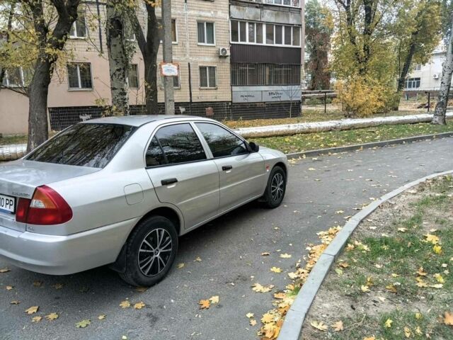 Серый Мицубиси Лансер, объемом двигателя 1.3 л и пробегом 157 тыс. км за 1679 $, фото 1 на Automoto.ua