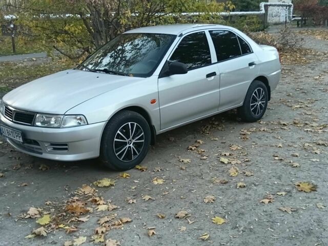Серый Мицубиси Лансер, объемом двигателя 1.3 л и пробегом 157 тыс. км за 1679 $, фото 4 на Automoto.ua