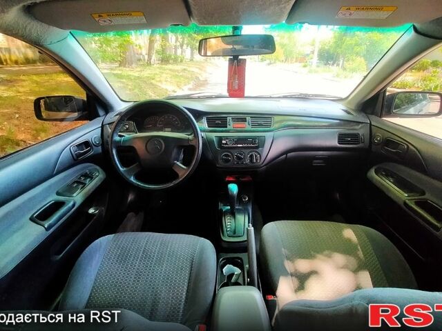 Серый Мицубиси Лансер, объемом двигателя 2 л и пробегом 269 тыс. км за 3800 $, фото 6 на Automoto.ua
