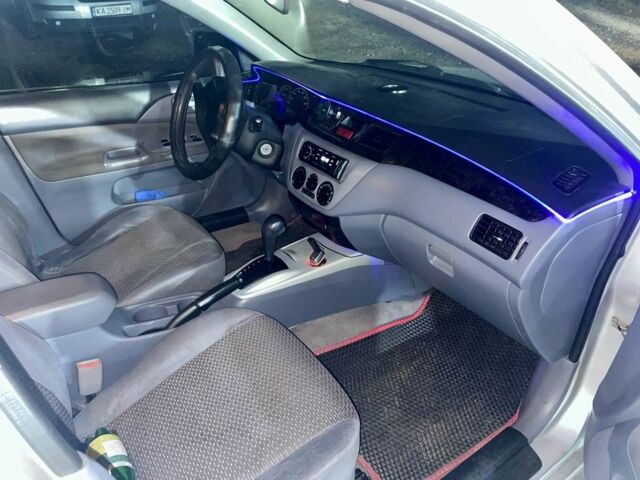 Сірий Міцубісі Lancer, об'ємом двигуна 2 л та пробігом 3 тис. км за 3850 $, фото 3 на Automoto.ua