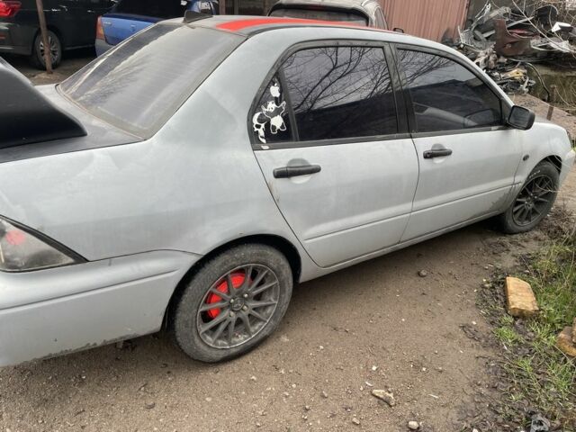 Сірий Міцубісі Lancer, об'ємом двигуна 2 л та пробігом 250 тис. км за 1500 $, фото 3 на Automoto.ua