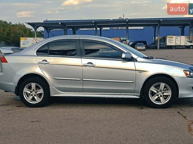 Серый Мицубиси Лансер, объемом двигателя 1.5 л и пробегом 166 тыс. км за 6999 $, фото 1 на Automoto.ua