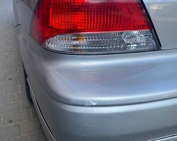 Сірий Міцубісі Lancer, об'ємом двигуна 2 л та пробігом 184 тис. км за 3999 $, фото 4 на Automoto.ua