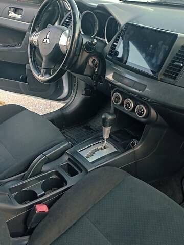 Серый Мицубиси Лансер, объемом двигателя 1.5 л и пробегом 166 тыс. км за 6999 $, фото 2 на Automoto.ua