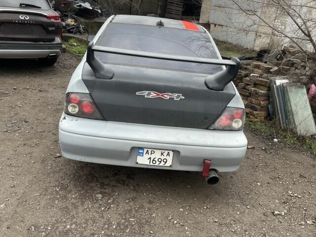 Сірий Міцубісі Lancer, об'ємом двигуна 2 л та пробігом 250 тис. км за 1500 $, фото 2 на Automoto.ua