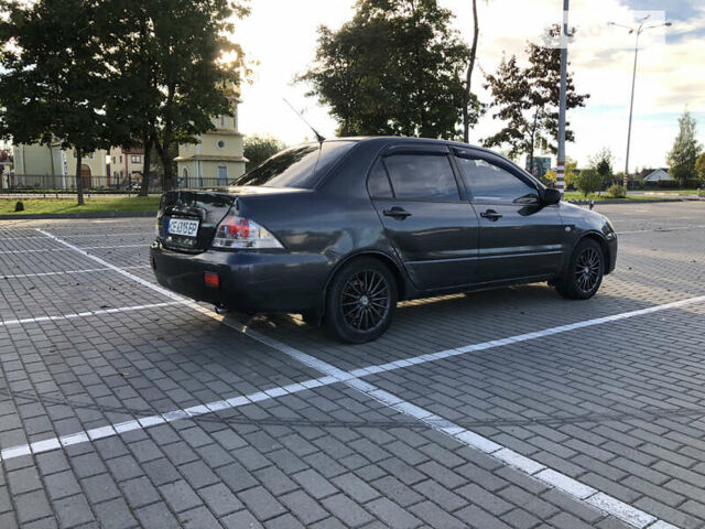 Сірий Міцубісі Lancer, об'ємом двигуна 1.58 л та пробігом 232 тис. км за 2899 $, фото 12 на Automoto.ua