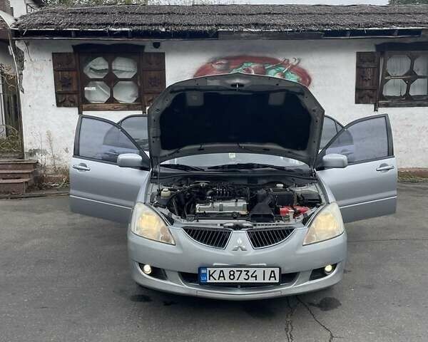 Сірий Міцубісі Lancer, об'ємом двигуна 1.6 л та пробігом 343 тис. км за 3850 $, фото 6 на Automoto.ua