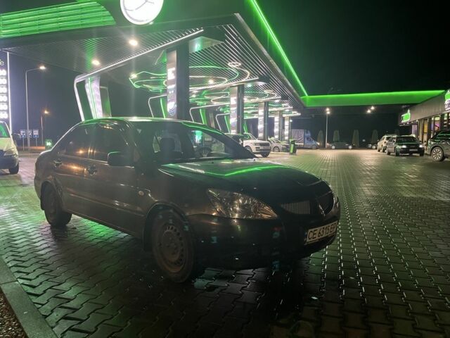 Серый Мицубиси Лансер, объемом двигателя 1.6 л и пробегом 269 тыс. км за 2999 $, фото 1 на Automoto.ua