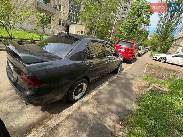 Сірий Міцубісі Lancer, об'ємом двигуна 1.6 л та пробігом 272 тис. км за 5100 $, фото 3 на Automoto.ua