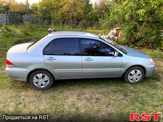 Сірий Міцубісі Lancer, об'ємом двигуна 1.6 л та пробігом 390 тис. км за 4400 $, фото 2 на Automoto.ua
