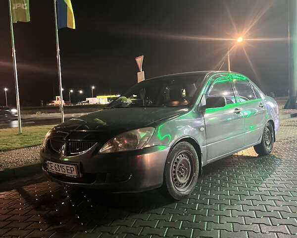 Сірий Міцубісі Lancer, об'ємом двигуна 1.58 л та пробігом 232 тис. км за 2899 $, фото 1 на Automoto.ua