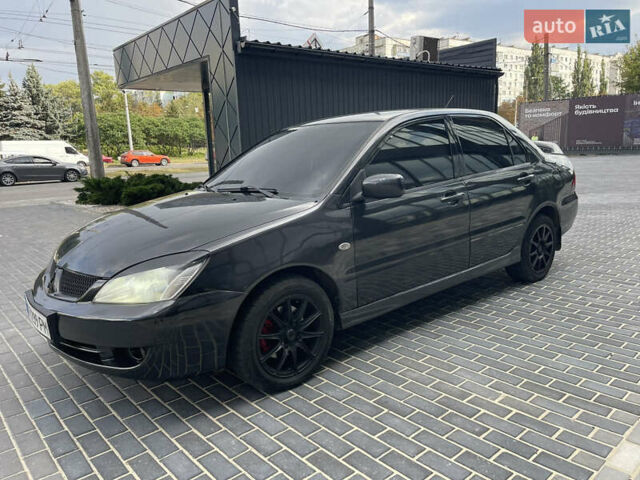 Сірий Міцубісі Lancer, об'ємом двигуна 1.6 л та пробігом 250 тис. км за 3300 $, фото 3 на Automoto.ua