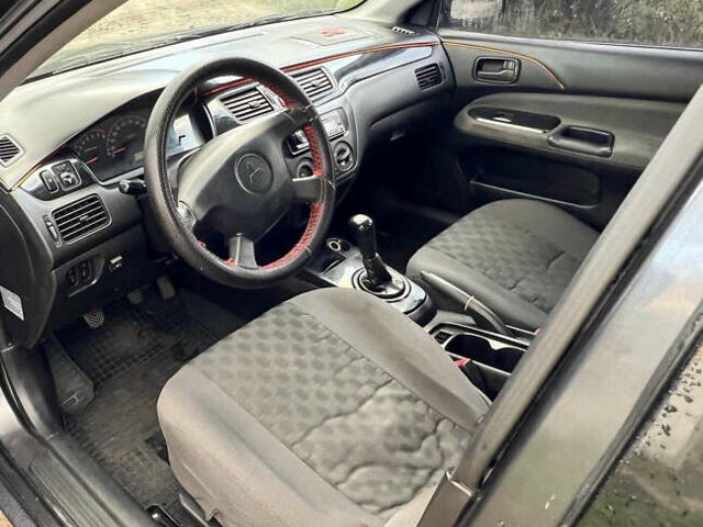 Сірий Міцубісі Lancer, об'ємом двигуна 1.58 л та пробігом 232 тис. км за 2899 $, фото 26 на Automoto.ua