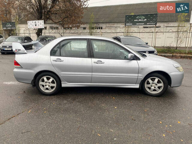 Сірий Міцубісі Lancer, об'ємом двигуна 1.6 л та пробігом 171 тис. км за 4600 $, фото 2 на Automoto.ua