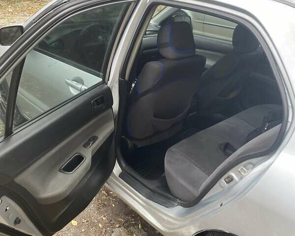 Мицубиси Лансер 2003 в Белой Церкве на Automoto.ua Серый Мицубиси Лансер, объемом двигателя 1.58 л и пробегом 350 тыс. км за 3300 $, фото 12 на Automoto.ua