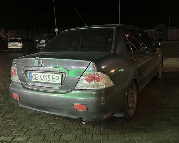 Сірий Міцубісі Lancer, об'ємом двигуна 1.58 л та пробігом 232 тис. км за 2899 $, фото 5 на Automoto.ua