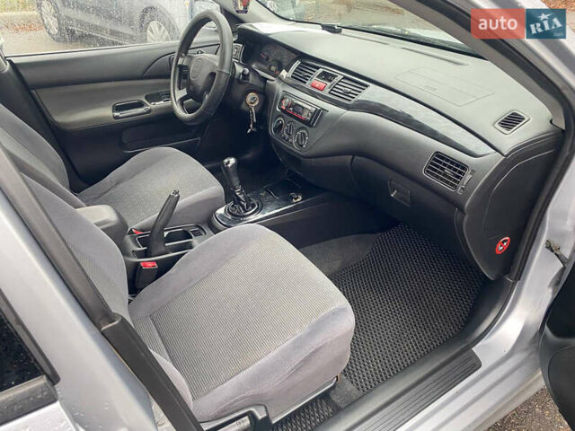 Сірий Міцубісі Lancer, об'ємом двигуна 1.6 л та пробігом 171 тис. км за 4600 $, фото 9 на Automoto.ua