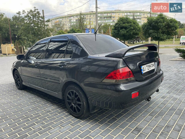 Сірий Міцубісі Lancer, об'ємом двигуна 1.6 л та пробігом 250 тис. км за 3300 $, фото 5 на Automoto.ua