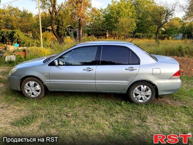 Сірий Міцубісі Lancer, об'ємом двигуна 1.6 л та пробігом 390 тис. км за 4400 $, фото 3 на Automoto.ua