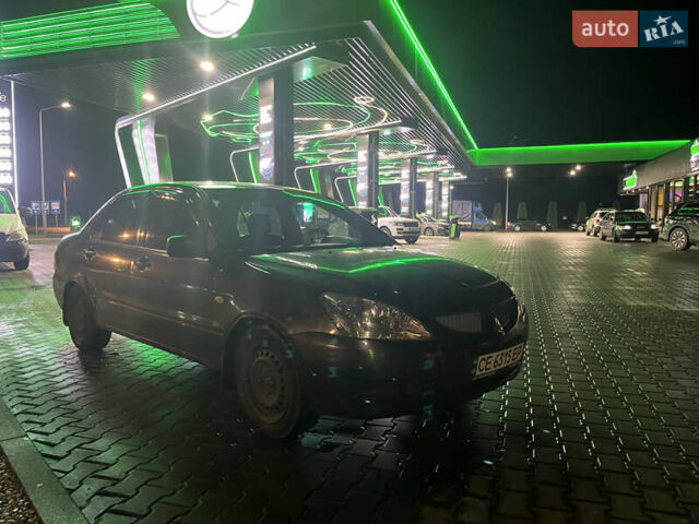 Сірий Міцубісі Lancer, об'ємом двигуна 1.58 л та пробігом 232 тис. км за 2899 $, фото 8 на Automoto.ua