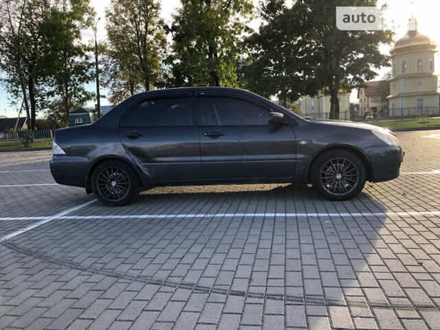 Сірий Міцубісі Lancer, об'ємом двигуна 1.58 л та пробігом 232 тис. км за 2899 $, фото 11 на Automoto.ua