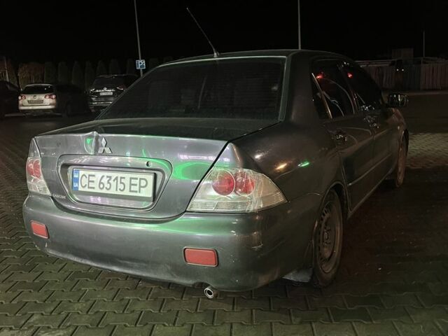 Серый Мицубиси Лансер, объемом двигателя 1.6 л и пробегом 269 тыс. км за 2999 $, фото 3 на Automoto.ua