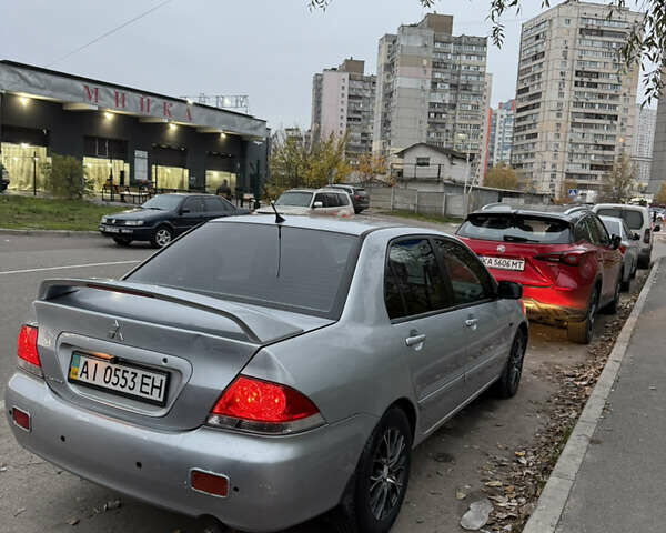 Сірий Міцубісі Lancer, об'ємом двигуна 1.58 л та пробігом 299 тис. км за 3850 $, фото 3 на Automoto.ua