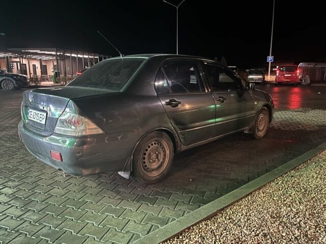 Серый Мицубиси Лансер, объемом двигателя 1.6 л и пробегом 269 тыс. км за 2999 $, фото 2 на Automoto.ua