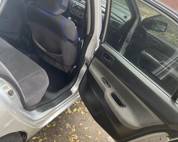 Мицубиси Лансер 2003 в Белой Церкве на Automoto.ua Серый Мицубиси Лансер, объемом двигателя 1.58 л и пробегом 350 тыс. км за 3300 $, фото 10 на Automoto.ua