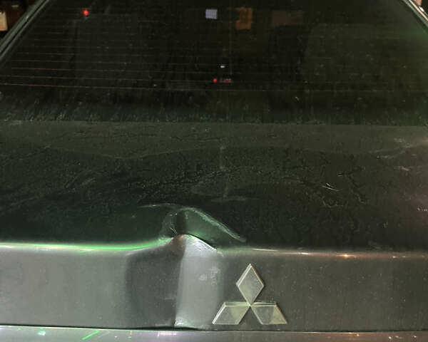 Сірий Міцубісі Lancer, об'ємом двигуна 1.58 л та пробігом 232 тис. км за 2899 $, фото 4 на Automoto.ua