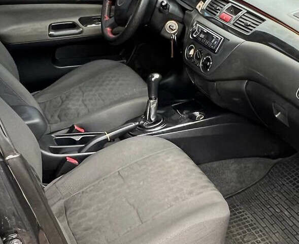 Сірий Міцубісі Lancer, об'ємом двигуна 1.58 л та пробігом 232 тис. км за 2899 $, фото 25 на Automoto.ua